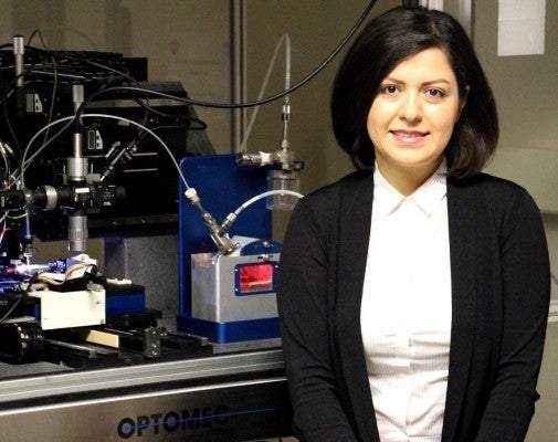 Elahe Jabari next to 3D printer