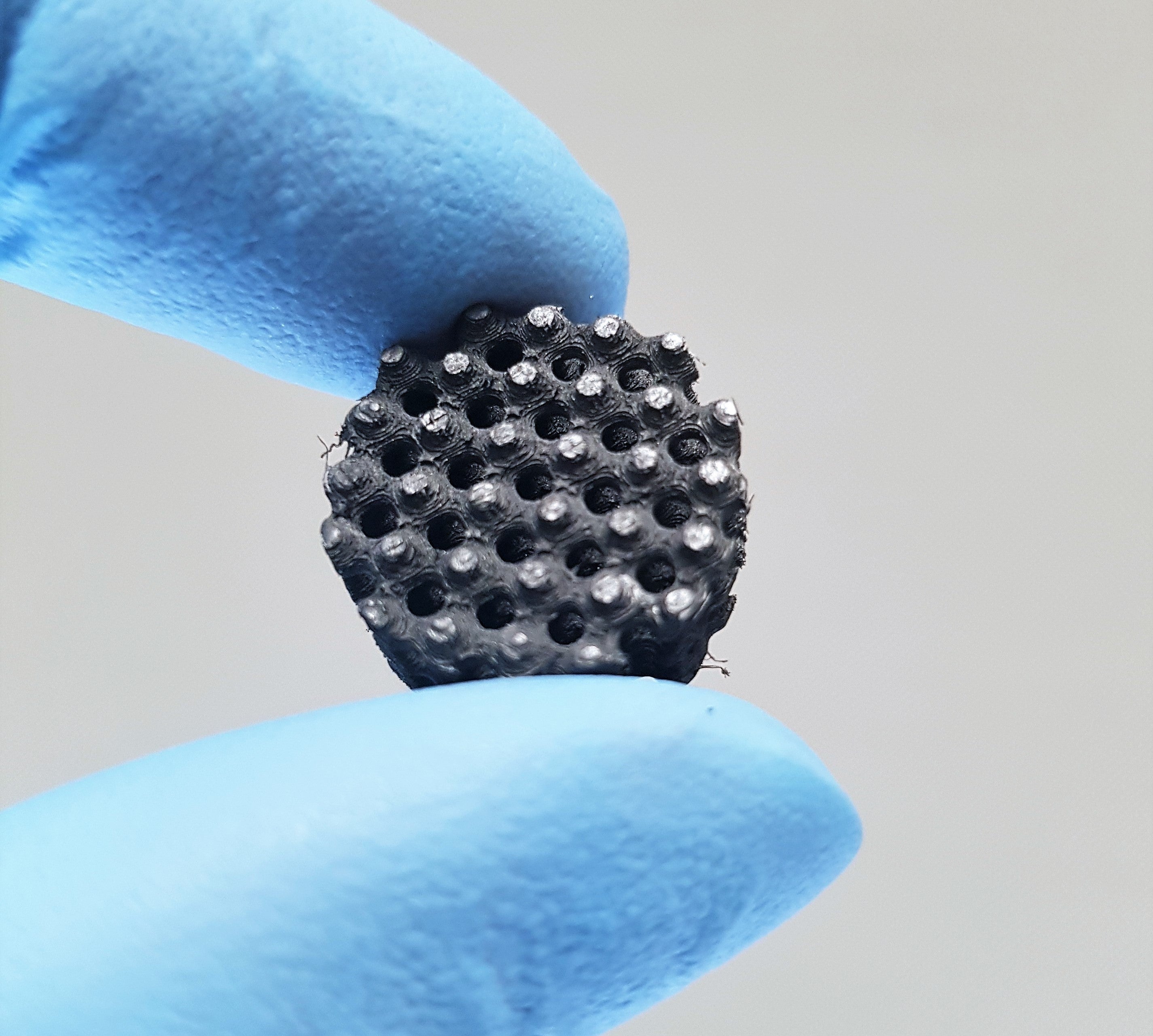 A close-up shows the honeycomb structure of a new sensing material invented by researchers.