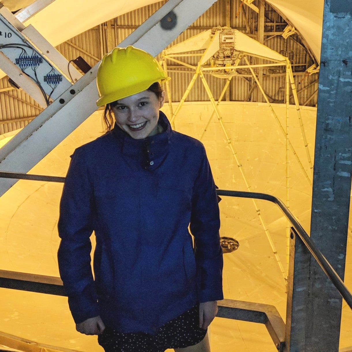 Emily with hard hat on.
