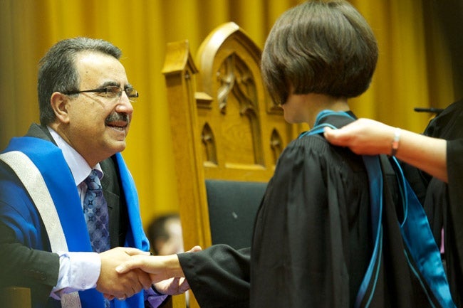 President congratulating a student