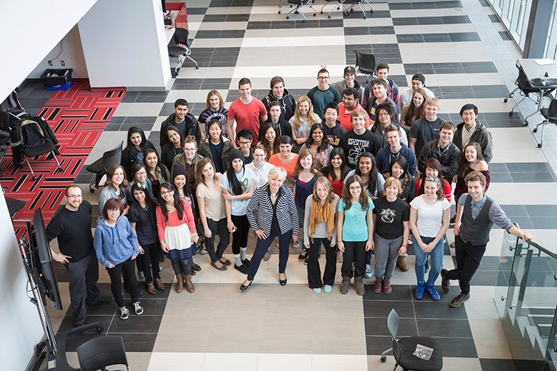 group shot of 2 dozen people at the conference