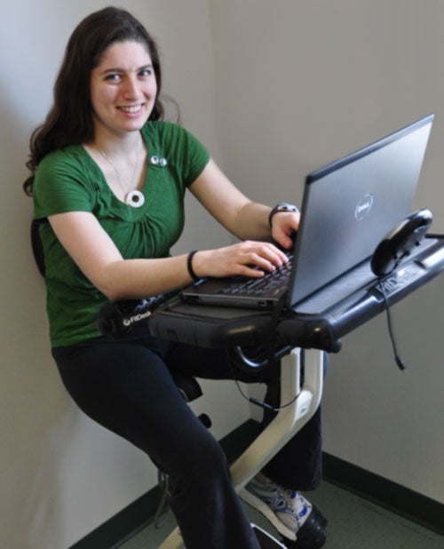 Laura Barkin working on a stationery bike