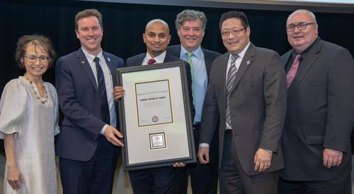 Dean Pearl Sullivan poses with General Motors of Canada executives (left to right) Travis Hester, Derek Sequeira, David Paterson, Brian Tossan and Gary Smyth.