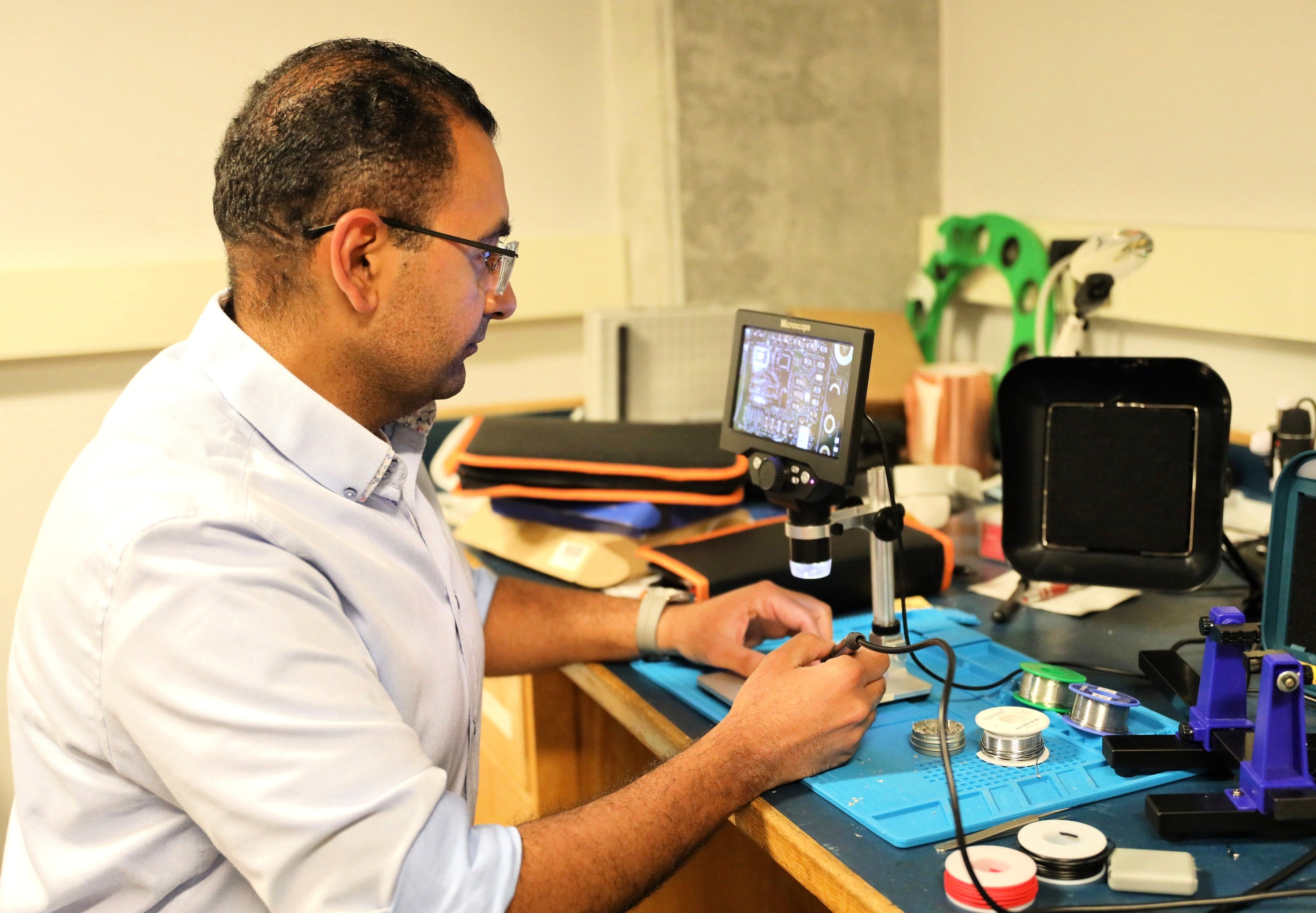 Dr. Shaker works on his radar device in his lab at the University of Waterloo.