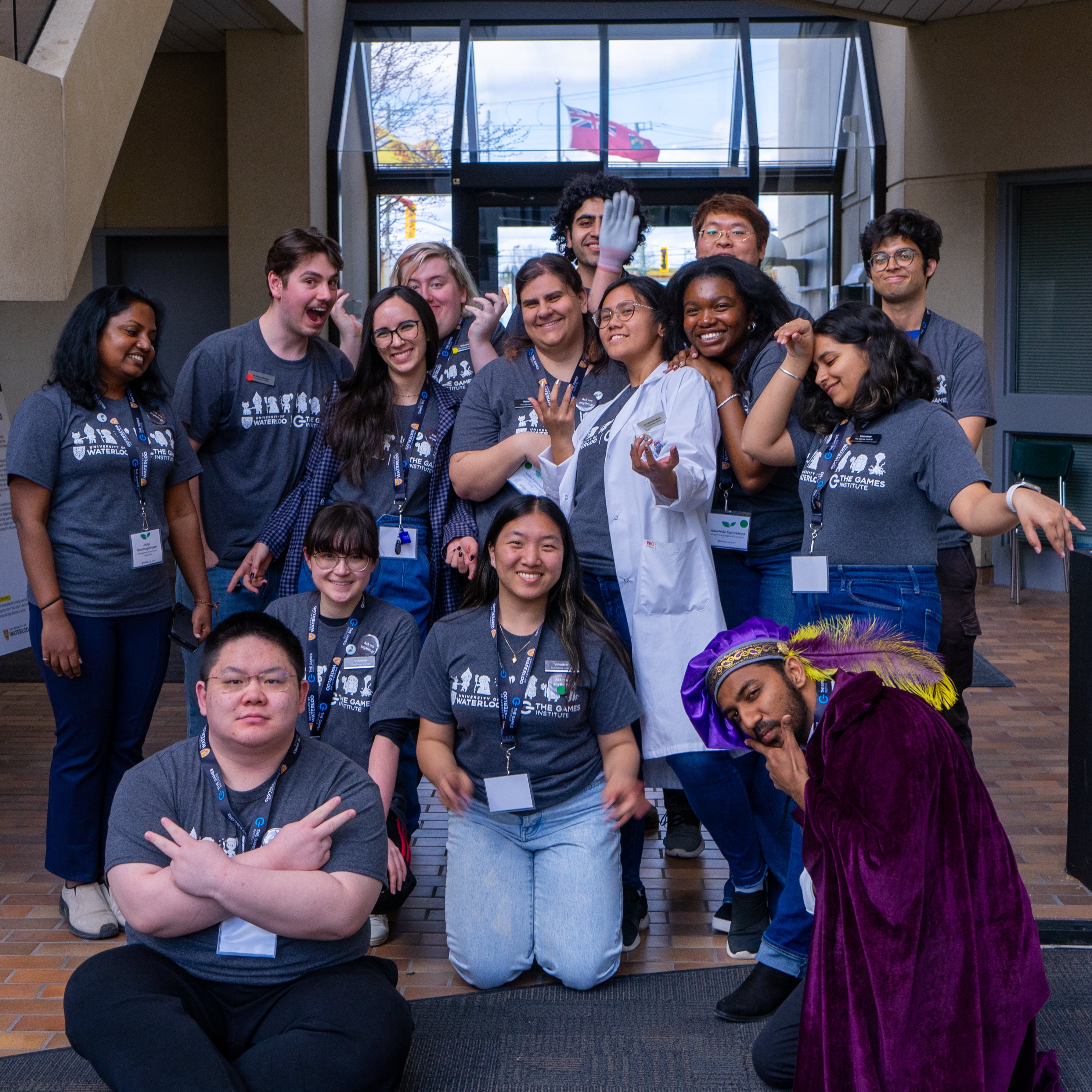 A group of Games Institute members wearing grey t-shirts and dark coloured jeans