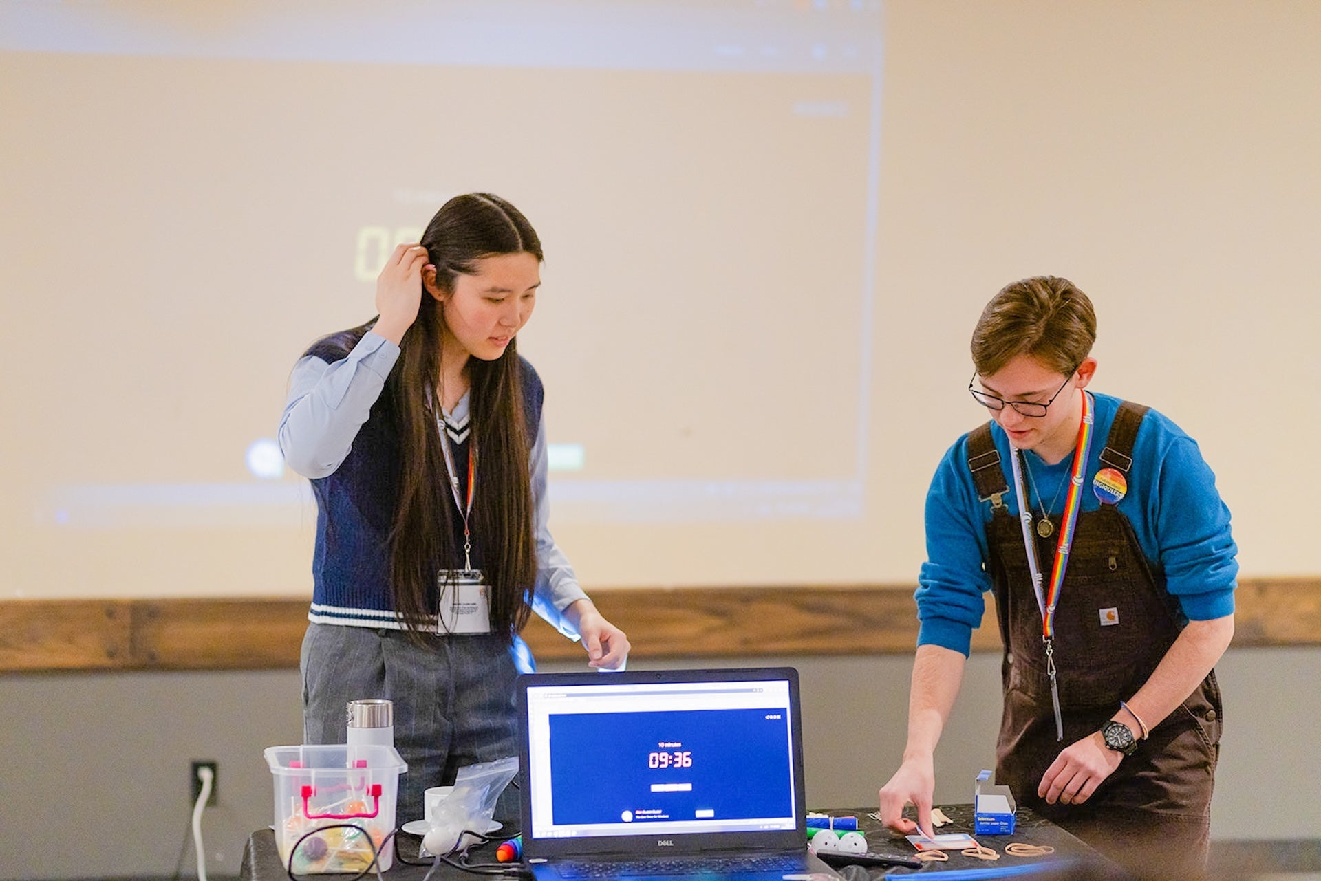 Lucas Shumaker and Arden Song presenting EngiQueers at the OK2BeMe conference to a group of high school students