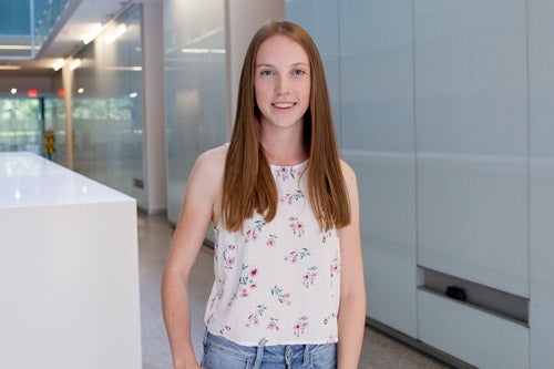 Heather Musson standing in QNC hall