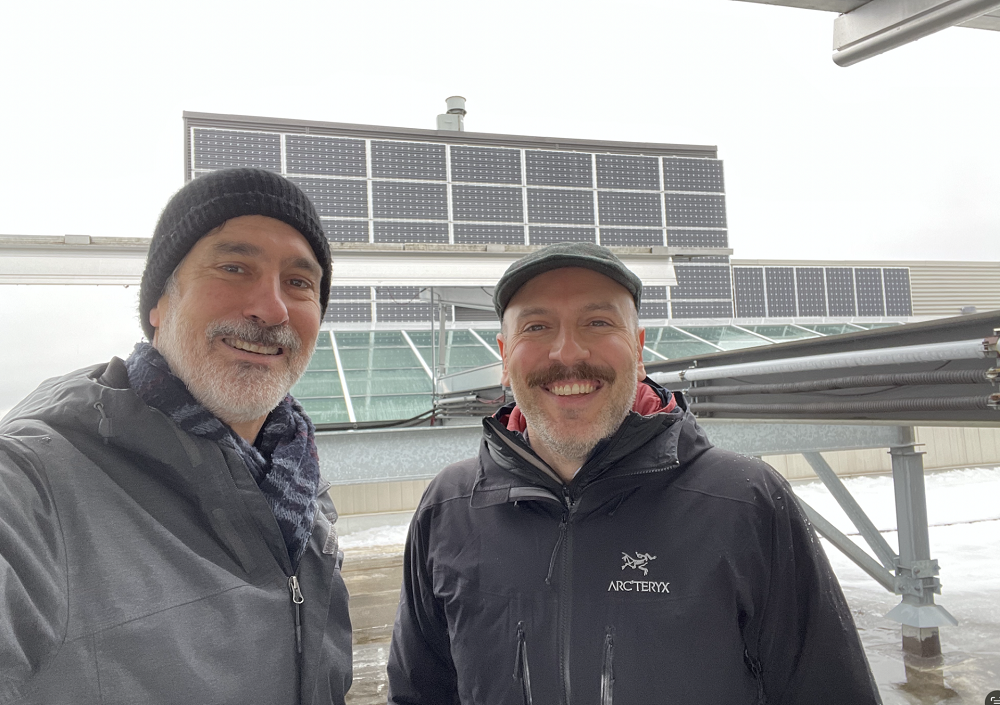 Dr. Ian Rowlands and Dr. Costa Kapsis beside the original EV3 solar panels.