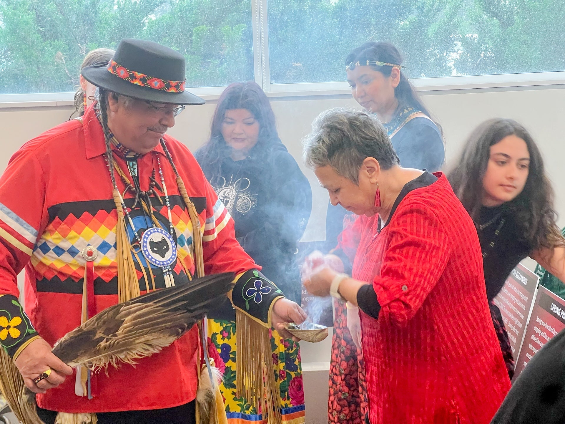 Elder Myeengun Henry and Jean Becker during the smudging ceremony at Red Dress Day in 2024