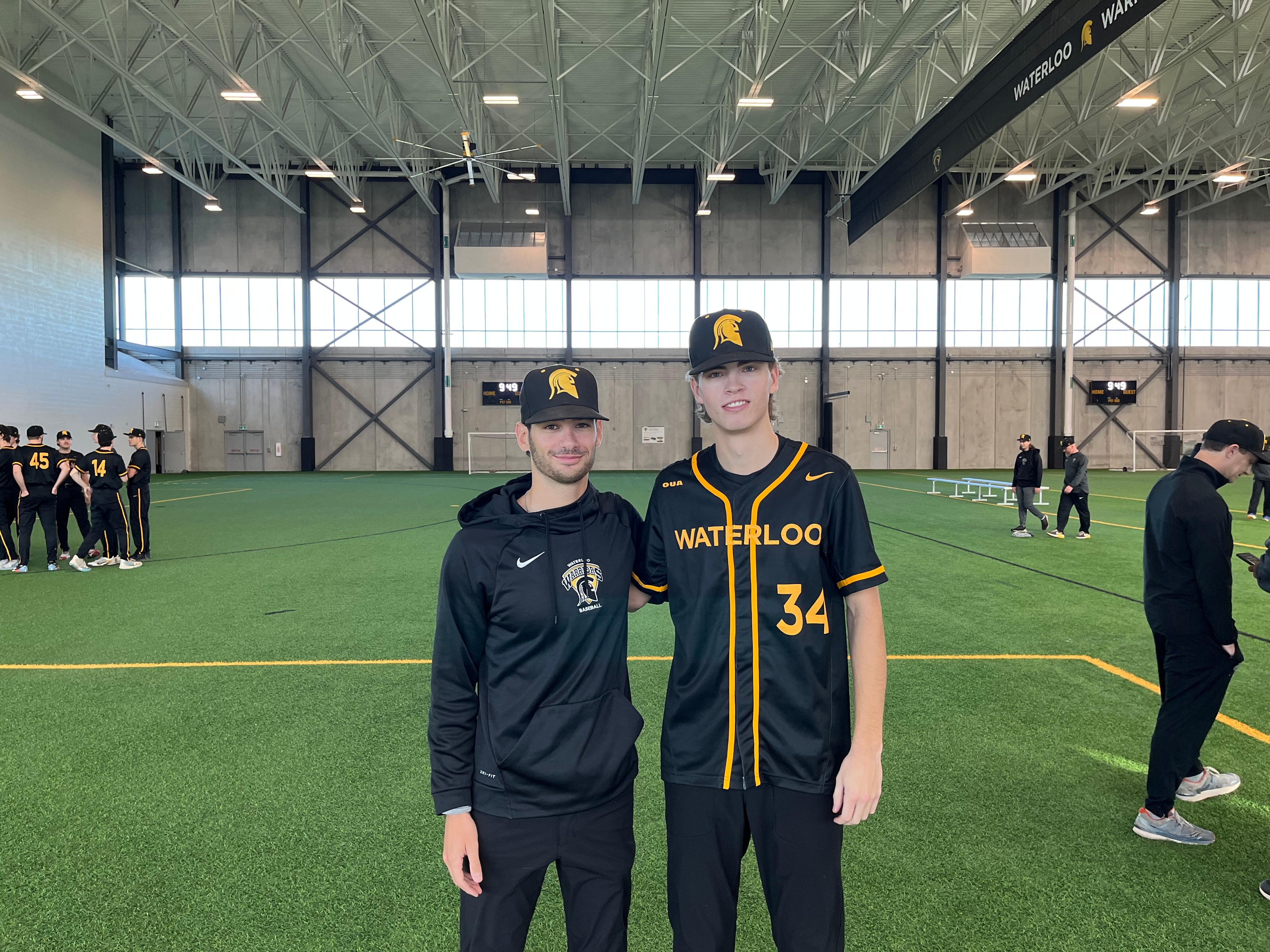 Jesse Levine poses inside the Field House with Ryan McNeill