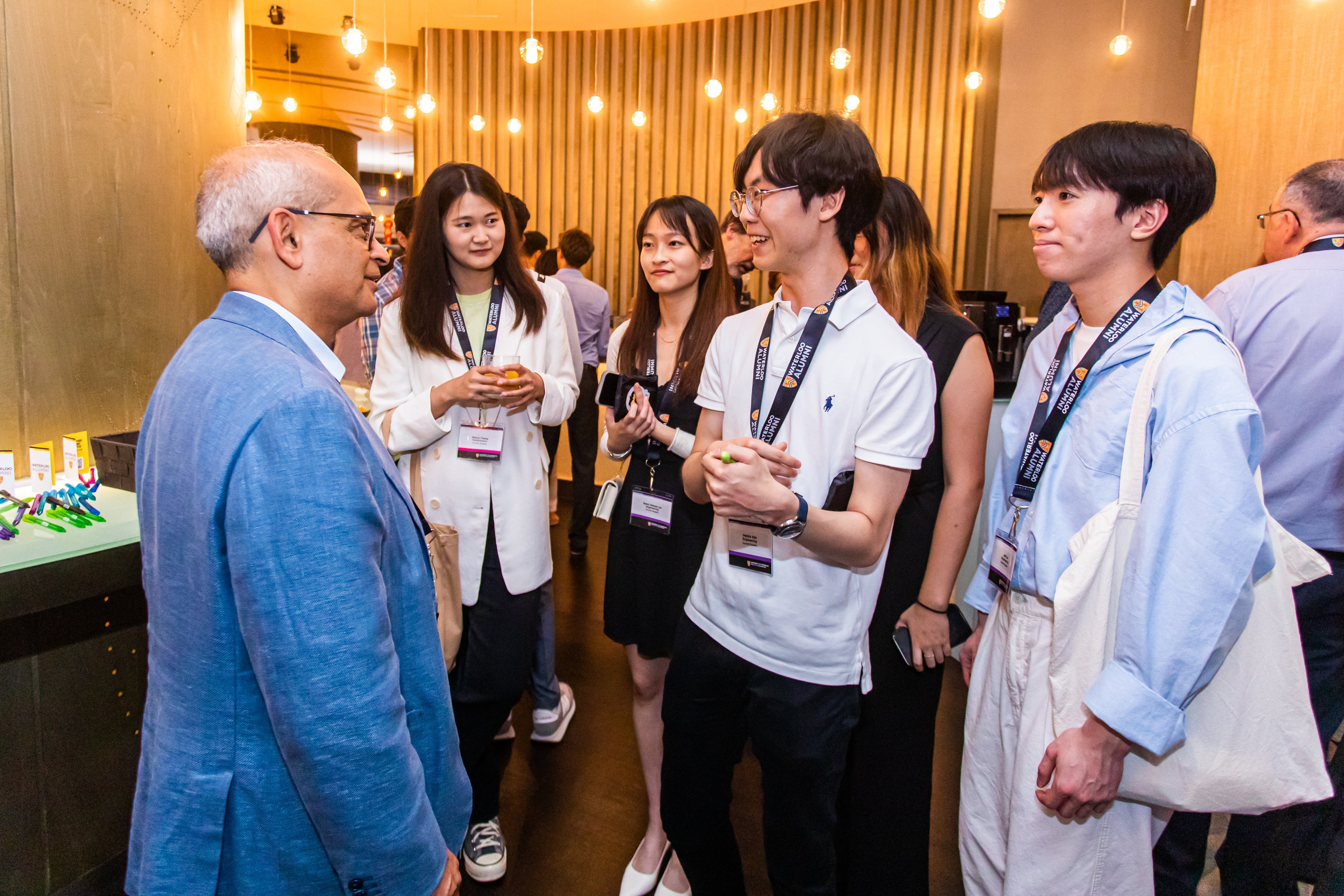 Vivek listening to students on one of his trips to Asia