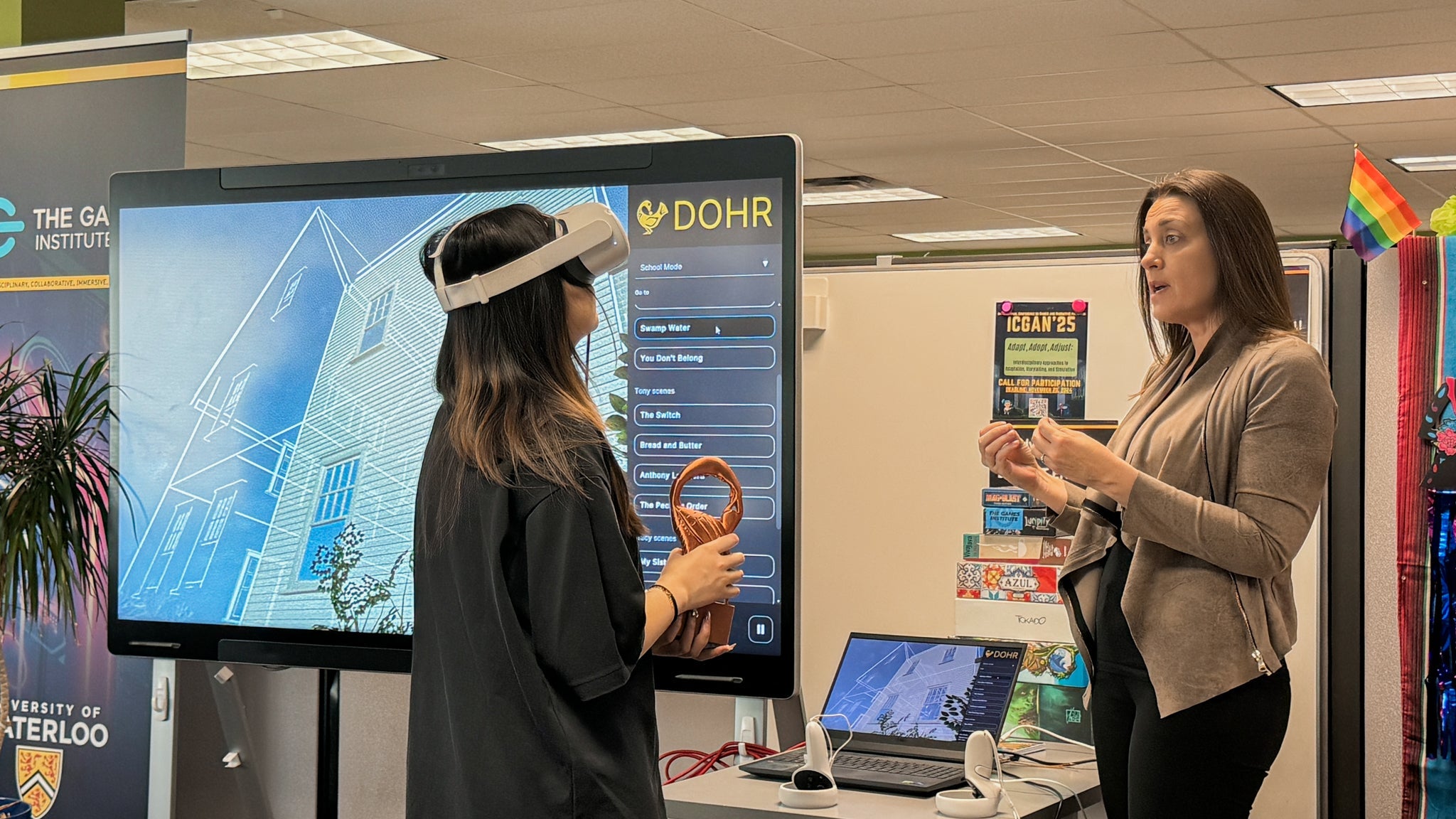 Llewellyn explaining the Digital Oral Histories for Reconciliation (DOHR) project to a co-op student