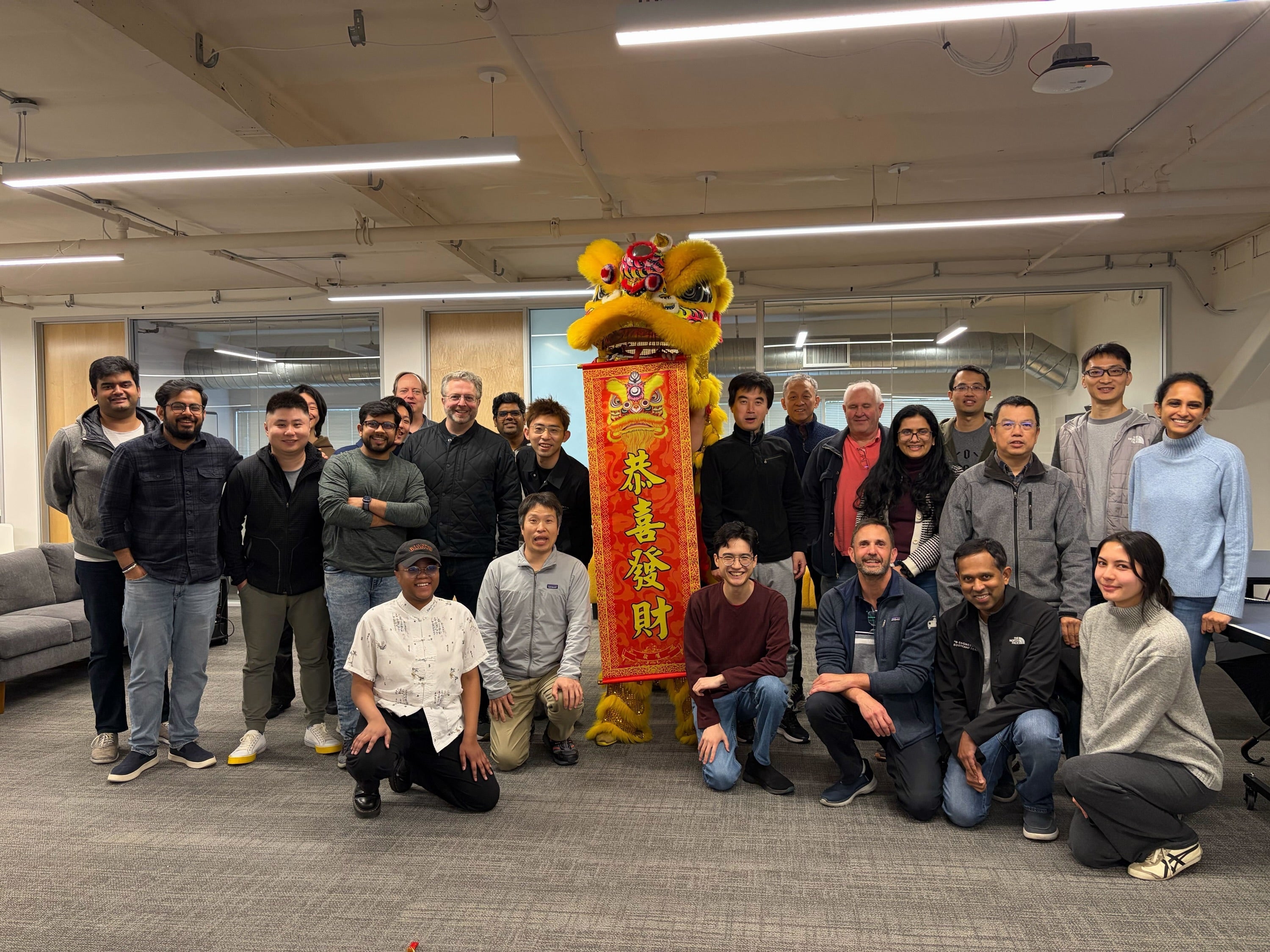 Atoms staff pose with co-op students during Chinese New Year celebrations
