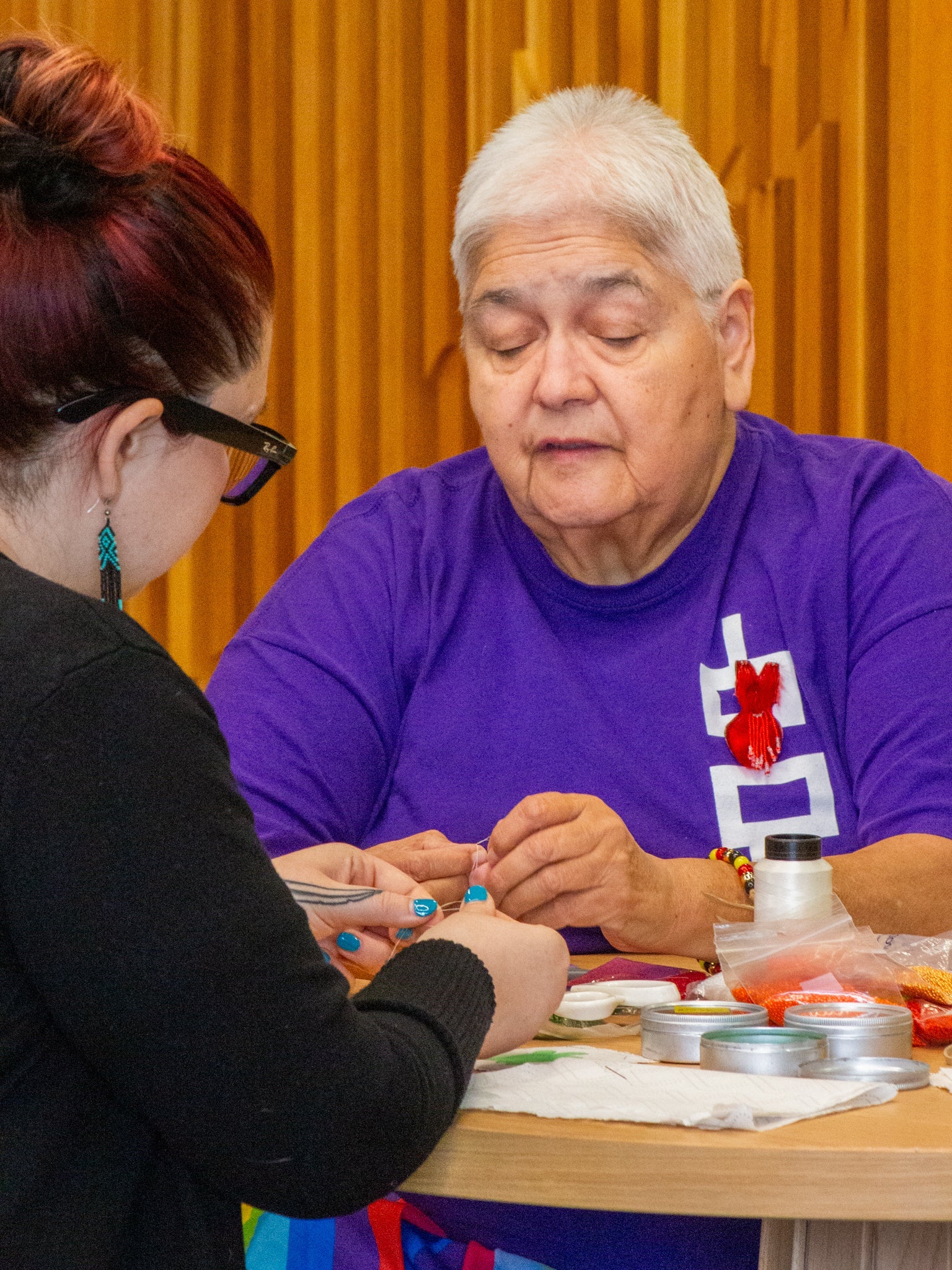 Rhea Green with Alissa Gee working on beadwork together