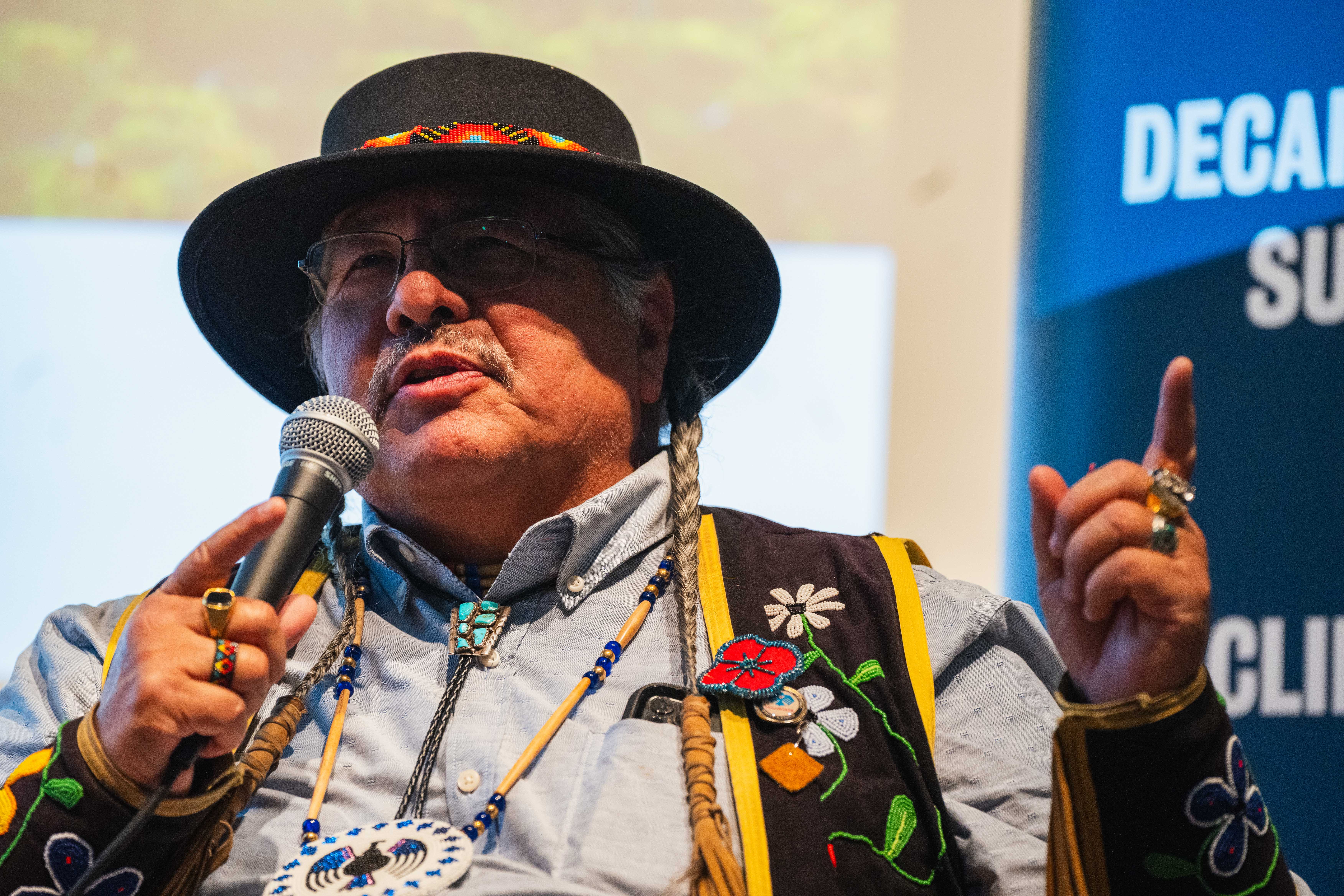 Elder Myeengun Henry sharing Indigenous approaches to wellness and connection to land.
