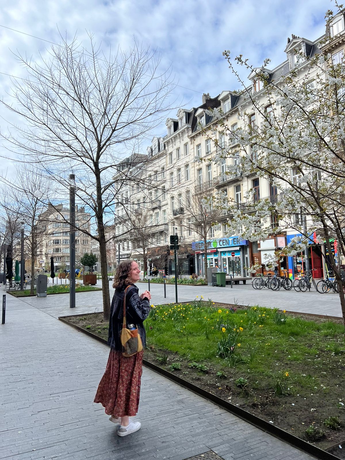 Kaitlyn Bowles stands in front of a series of shops in Brussels, Belgium