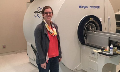 Physics alumnus Kalya Sutton in lab