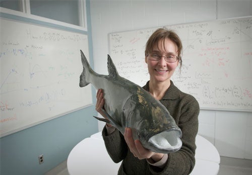 Kim Cuddington holds an Asian carp