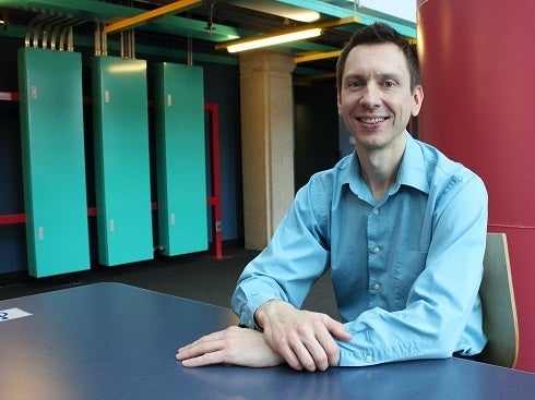 Lukasz Golab sitting at a desk in DC