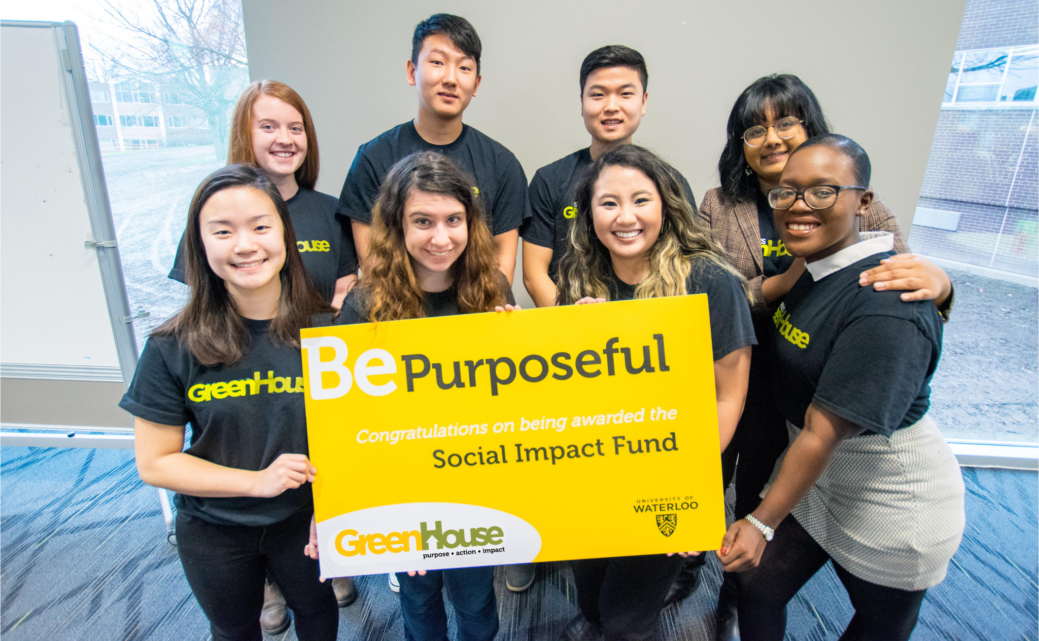 GreenHouse students smile at the camera with Social Impact Fund cheque