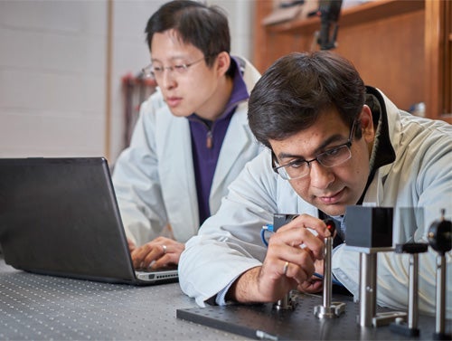 Alex Wong (back) and Shahid Haider