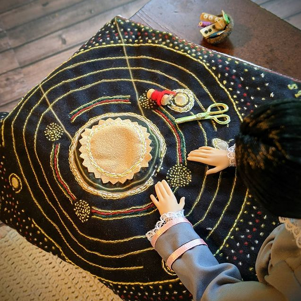 doll sticking quilt