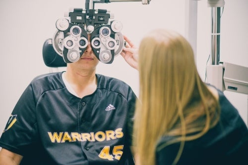 Dr Kristine Dalton examines a baseball player