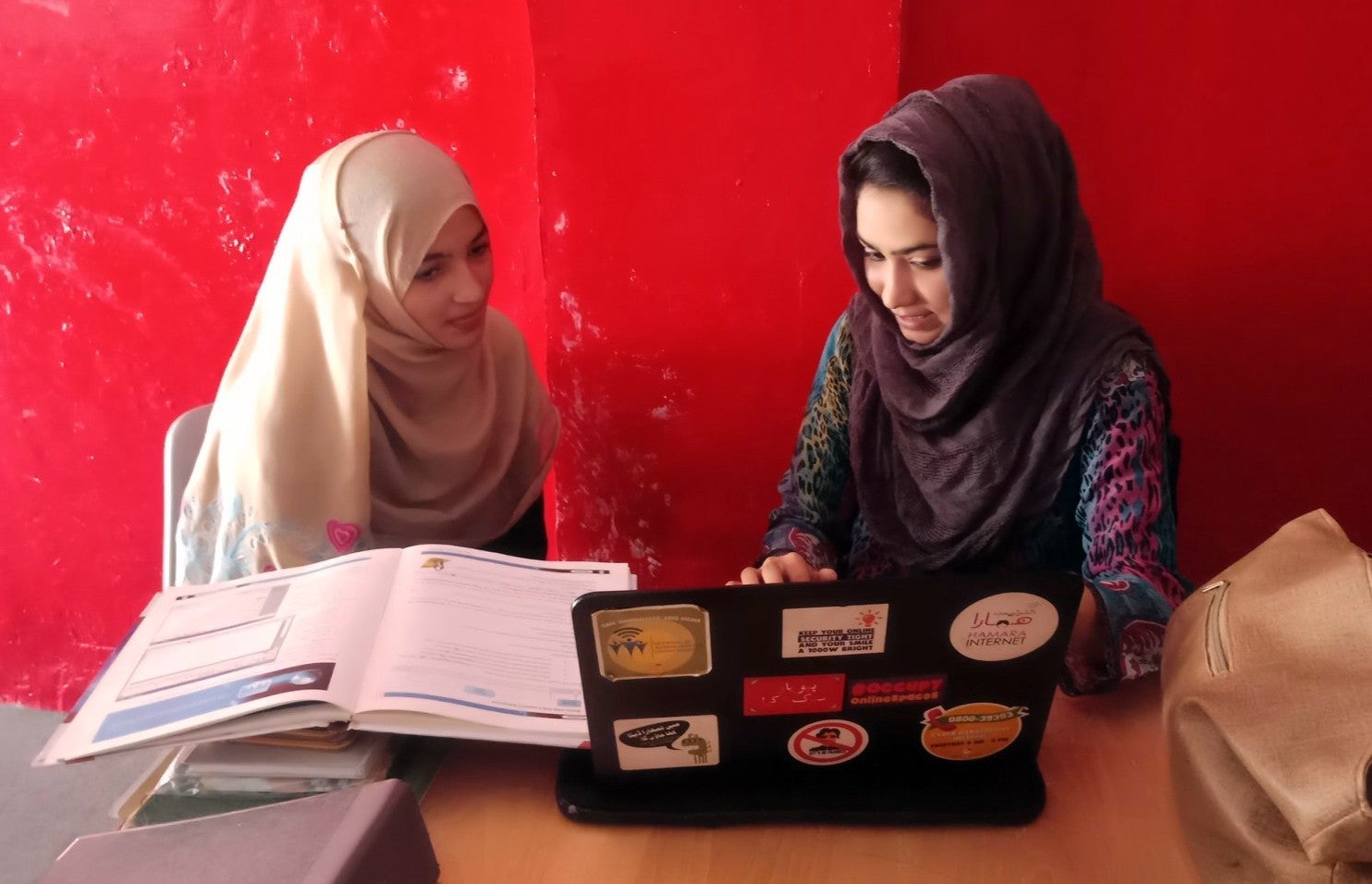 Teachers in Pakistan work on lesson plans.