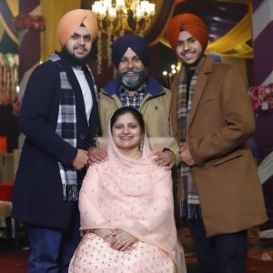 Family photo with Paramvir, his brother, mother and father.
