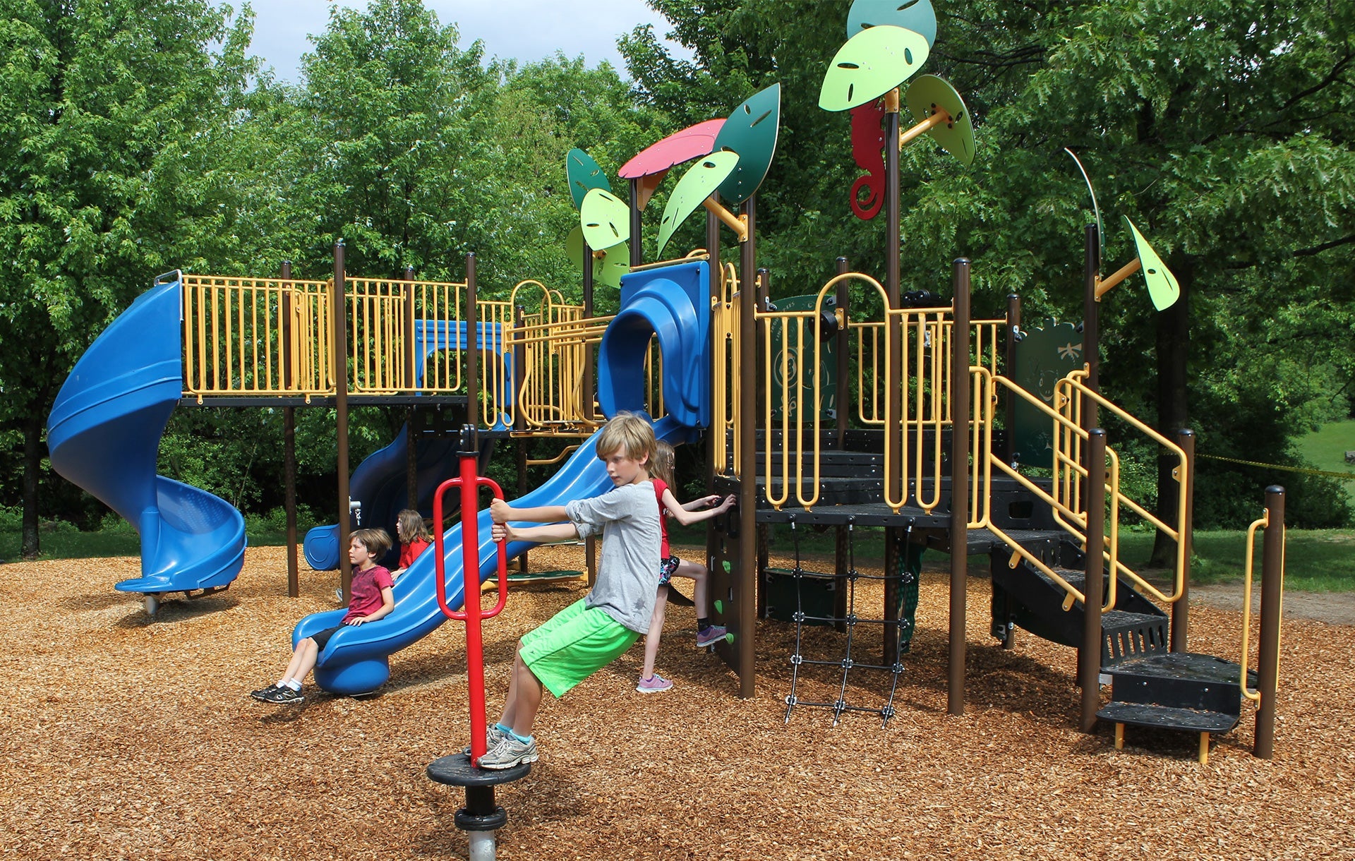 Pupils at Keatsway Public School in Waterloo try out the new playground structure designed by first-year Waterloo Engineering students.