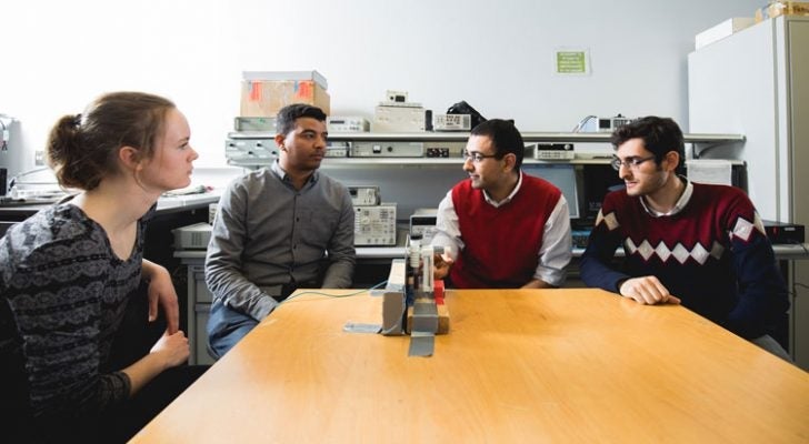 George Shaker (second from right) discusses research into the development of a glucose monitoring system for diabetics with students (left to right) Karly Smith, Ala Eldin Omer and Mostafa Alizadeh.