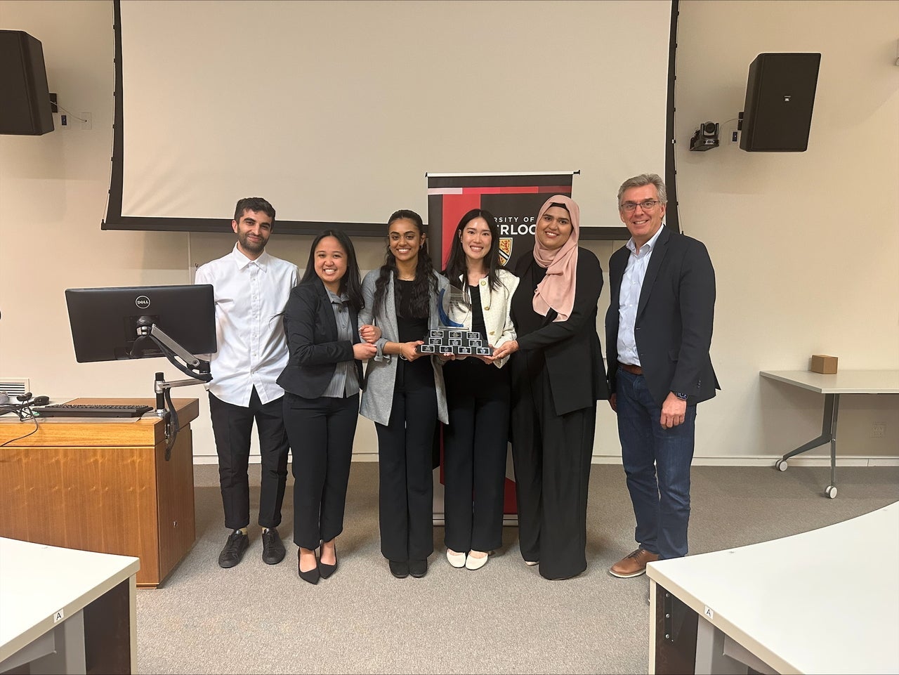 The group of award winners with the judges.