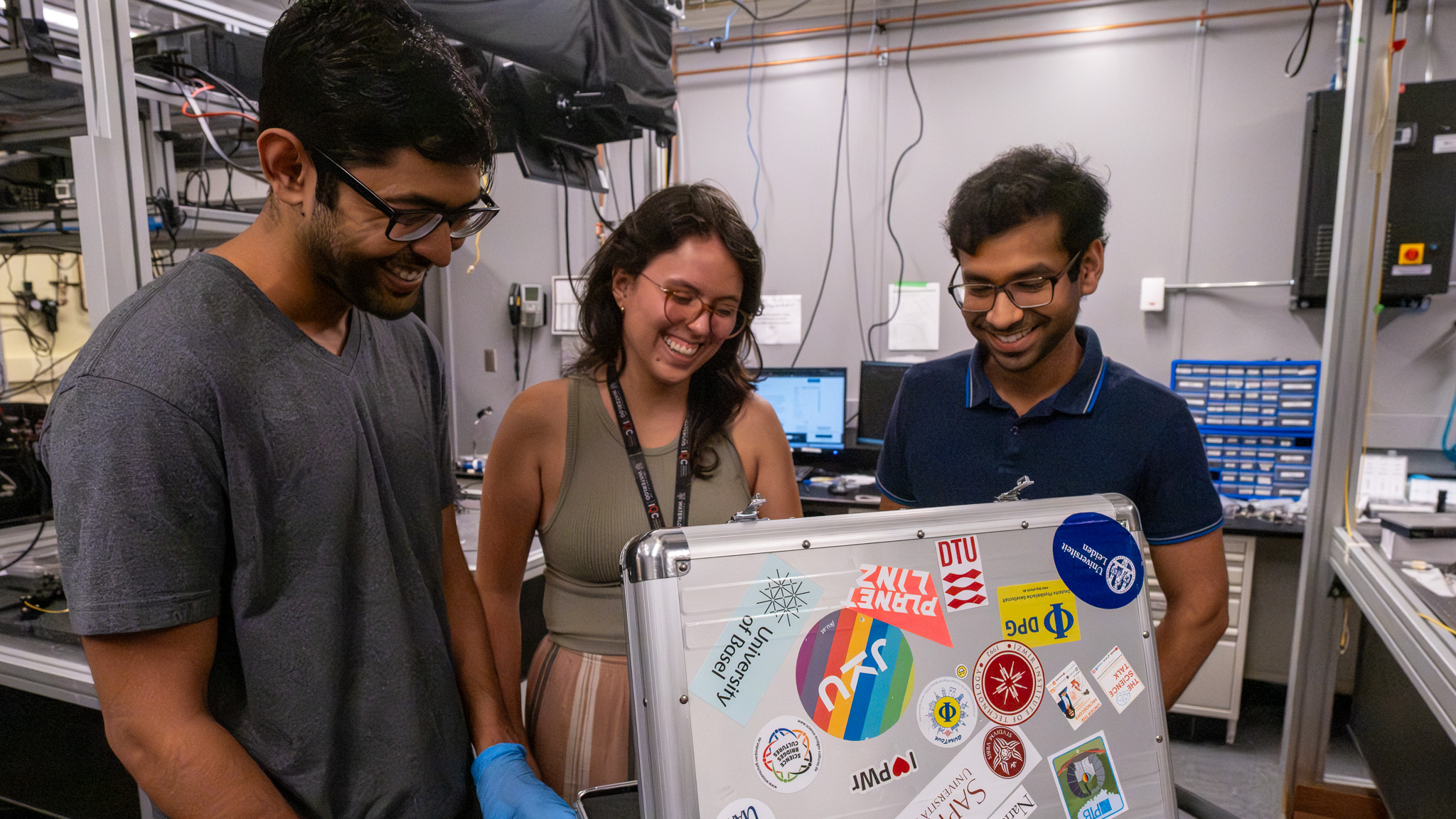 Quantum Photonics Devices Lab researchers Tarun Patel, Catalina Morales Gutiérrez, Sayan Gangopadhyay (L-R) inspecting the quant