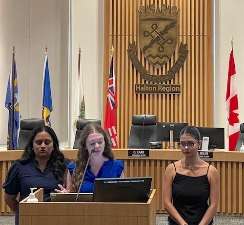 student team at the podium presenting work