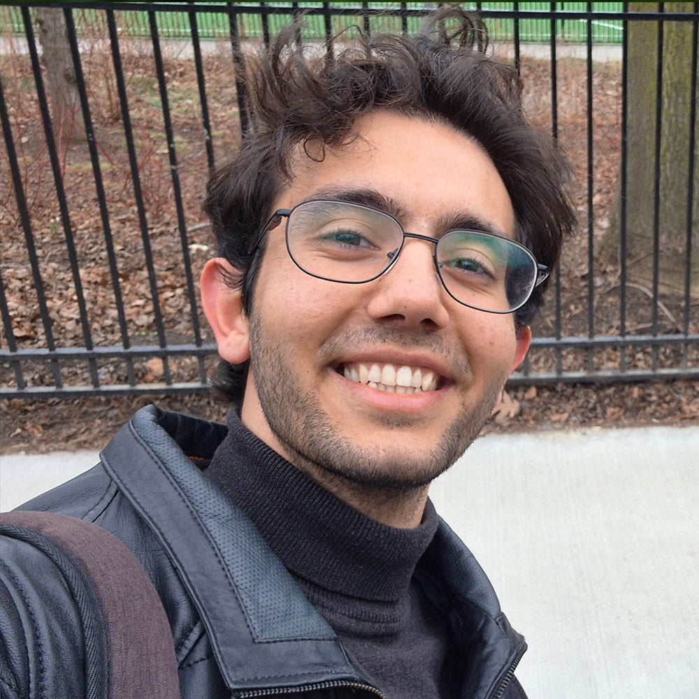 Sina Kalantarzadeh high angle perspective in a park near a gate