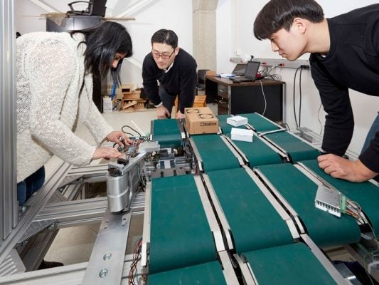 Soo Jean working with robotic companion purolator research