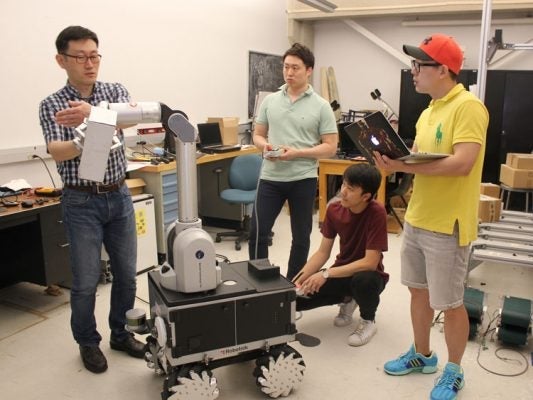 Soo Jean shows research work with his graduate students