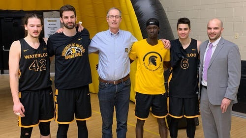 Stephen Garrett with men's basketball team