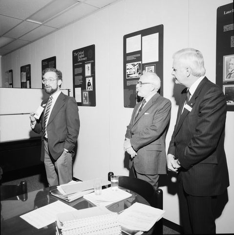 Frank Tompa shows Waterloo administrators the Centre for the Oxford English Dictionary