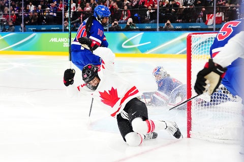 Kristin O'Neill cheers after she scores a goal during an Olympic hockey game.