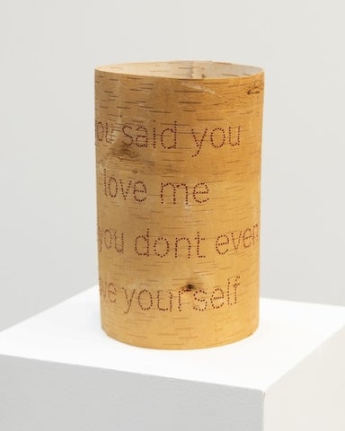 Birch bark artwork wrapped in a circle with the text: You said you love me you don't even love yourself