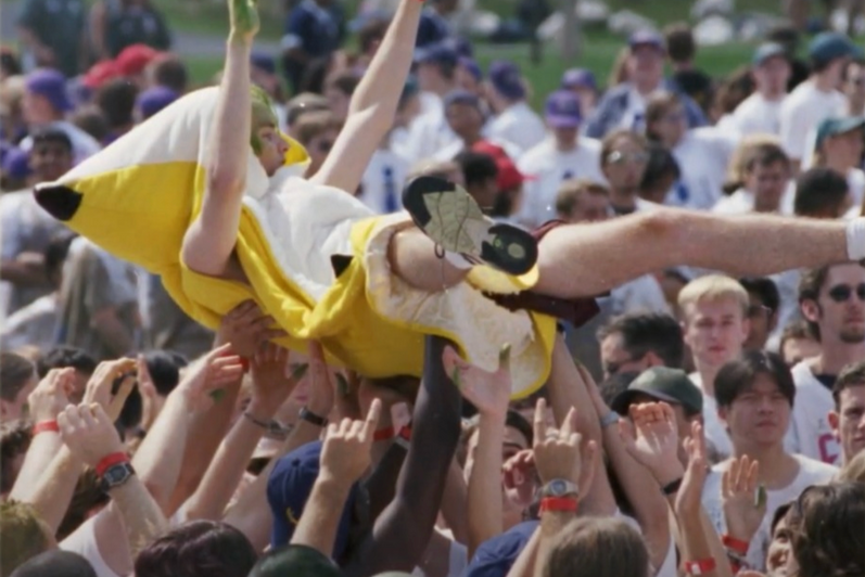 The Big Banana crowd surfing with a group of students