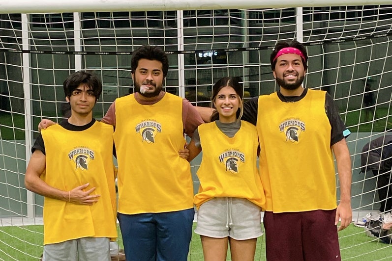 Sapna Tripathi at Waterloo's Field House with her three brothers dressed in soccer jerseys