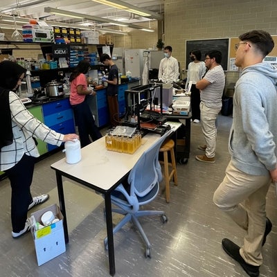 Undergrad student working on an experiment in a research lab 