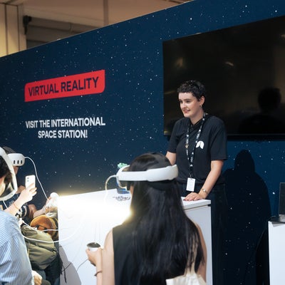 Emily Pittman guide visitors through a virtual reality tour of the International Space Station