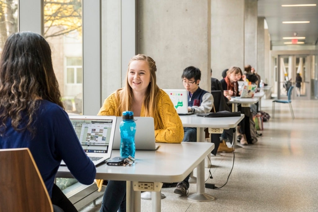 Students sitting in a lounge area