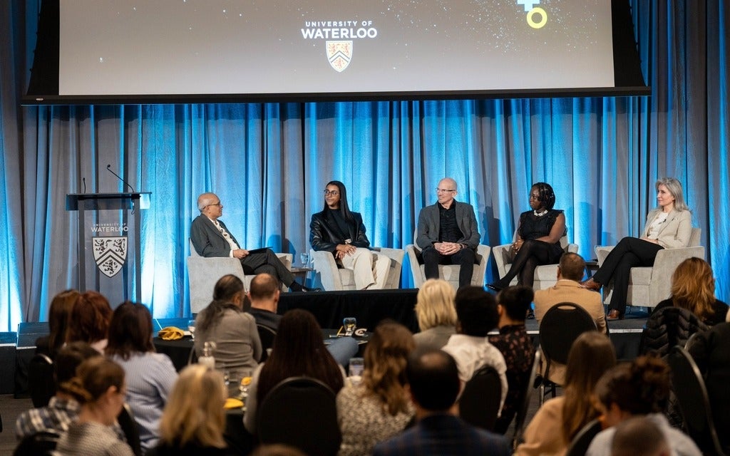 Vivek Goel, Rachel Almaw, Marcel O'Gorman, Seun Adetunji and Bessma Momani speaking in front of an audience