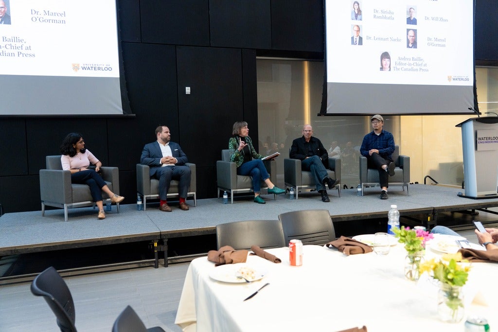 L-R: Drs. Sirisha Rambhatla, Lennart Nacke, Marcel O'Gorman, and Will Zhao sit on a panel moderated by Andrea Baillie (center).