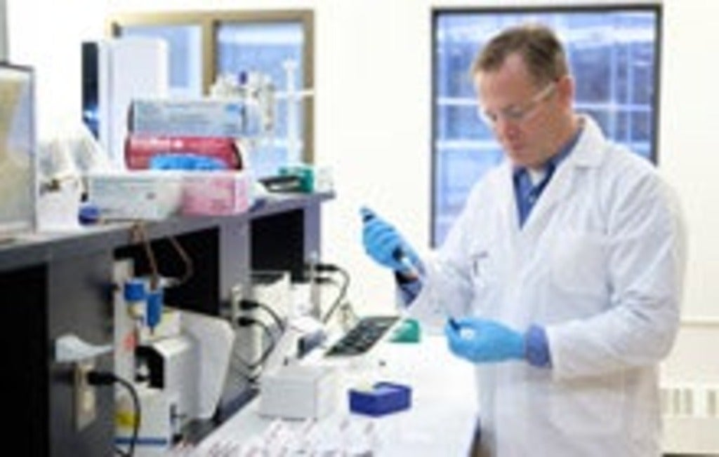 Professor Ken Stark taking a sample of blood in Waterloo laboratory