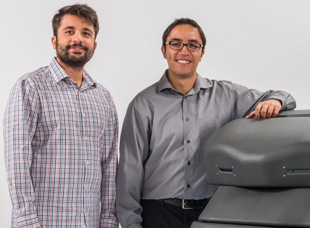 Avidbots founders Pablo Molina and Faizan Sheikh beside Neo